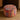 CharmyDecor round ottoman with colorful patterned jacquard upholstery in red blue and cream