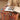 CharmyDecor round ottoman with colorful patterned upholstery used beside a reading area
