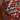 CharmyDecor round ottoman detail with red blue cream yarn dyed jacquard fabric