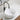 CharmyDecor gloss white round vessel sink with faceted sides on a bathroom vanity, styled with a black faucet