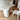 White desk with a unique design on a wooden floor