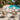charmydecor set of teak finish wicker patio chairs with white cushions arranged by swimming pool