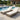 Charmydecor set of two grey brown wicker outdoor chaise lounges with beige cushions by a pool