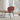 Charmydecor shell lounge chair red living room chair angled view in bright home interior with rug and natural light