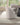charmydecor side view of light gray boucle chenille swivel dining chair with curved silhouette