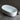 CharmyDecor stone resin bathtub filled with water in an angled bathroom scene beside a black floor-mounted faucet.