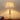 CharmyDecor tall brass and K9 crystal table lamp illuminated on wooden table