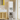 Charmydecor tall white bathroom cabinet with lower door open showing towel and bottle storage