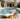Charmydecor teak finish acacia wood chaise lounge with cream cushion beside a swimming pool