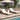 Charmydecor two outdoor acacia wood chaise lounges with cream cushions under a patio umbrella
