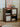 Wooden bookshelf with decorative items in a room setting