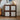 Wooden cabinet with mosaic tile design in a room with a guitar and decor items.