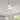 Ceiling fan mounted on a white ceiling with windows and greenery in the background