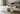 Charmydecor white marble coffee table with natural veining and slab base in a minimalist living room