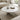 Charmydecor white marble coffee table with semi polished round top and decorative tray in a soft neutral living room