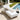 White outdoor chaise lounge with cream cushion styled beside a swimming pool by charmydecor