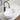 CharmyDecor white oval vessel sink on a bathroom vanity, styled with a black faucet