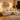 Charmydecor white sectional sofa with ottoman in warm cozy living room