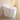 CharmyDecor white smart toilet with bidet in a bathroom, showing the glossy enclosed base and closed elongated lid.