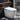 CharmyDecor white smart toilet with bidet and closed lid in a dark contemporary bathroom