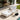 White solid acacia wood outdoor chaise lounge with cream cushion beside a pool by charmydecor