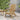 Charmydecor Zuma natural acacia wood folding Adirondack chair styled on an outdoor patio with side table