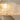 Close-up of chrome fastener on glowing textured acrylic light shade