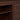 Close-up of espresso TV stand shelf and interior adjustable peg holes.