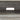 Close-up of rear cable cutout on the central media shelf of the farmhouse TV stand.