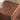 Close-up of solid wood vanity top with rich walnut grain texture
