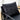Close-up view of the black leather back cushion on modern accent chair with metal frame