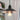Close-up of the industrial black pendant light with metal cage and Edison bulb