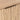 Close-up of brass-toned top-mounted cabinet handle