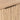 Close-up of brass-toned top-mounted cabinet handle