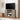 Compact farmhouse TV stand in a cozy corner with TV and decorative items.