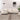 Cream white 3-seater modern sofa with chaise lounge in a minimalist living room setting