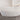Curved armrest design of white bouclé sofa captured from above