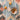 Top view of dried fruits and bowl on jute rug surface