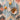 Top view of dried fruits and bowl on jute rug surface