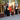 Group of fire columns placed among potted bamboo at outdoor event