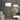 Floor lamp showing height adjustment knob and dual-tone brass design