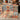 Folded jute rug showing backside and colorful design details