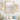 Front-facing view of gold mid-century wall sconce with round base and globe