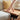 Hand lifting tabletop of the oak coffee table