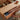 Hidden drawer storage of oak lift top coffee table being opened