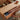 Hidden drawer storage of oak lift top coffee table being opened