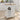 White kitchen cart with wooden top in a bright kitchen setting