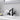 matte black dual joint faucet spraying water at angle