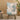 Rocking chair in cozy living room setting with light wood floor and round side table