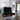 Mid century TV console styled with a large TV and open cabinet doors in modern space.